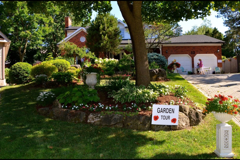 A view from the street of John and Mary McGimsie’s Sugar Bush Splendour garden on Pickwick Place during the Guelph Horticultural Society Annual Garden Tour.  Troy Bridgeman for GuelphToday.com