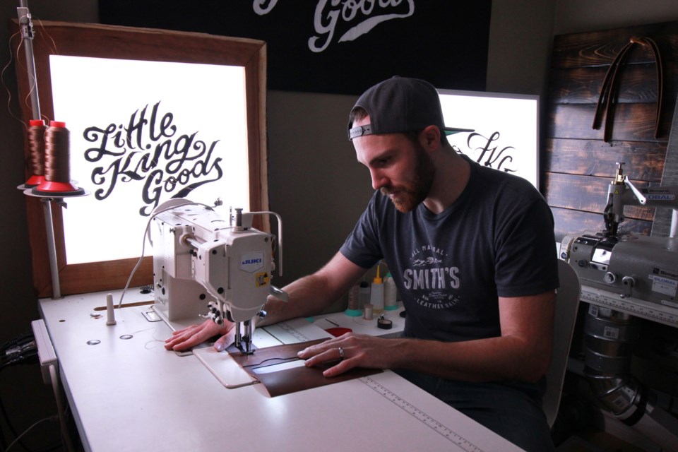 Ryan Savin uses a sewing machine in his studio for his machine stitched wallets. Anam Khan/GuelphToday