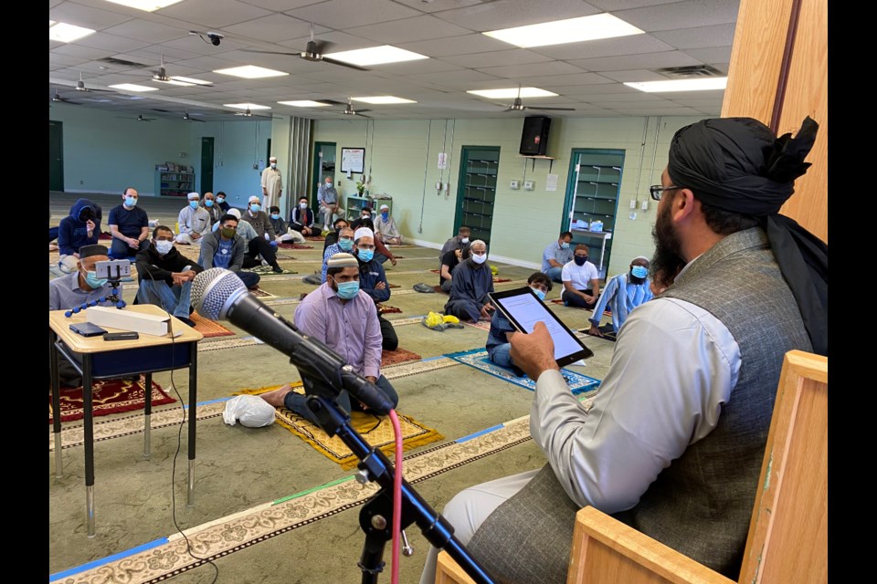 Imam Mubeen Bhatt delivers a sermon on Friday as the province officially begins Phase 2 of reopening. Supplied photo