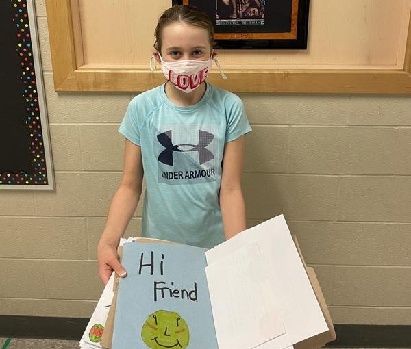 12-year-old Isabelle Peverley holds a folder of cards ready to be sent to three retirement homes in Guelph. Supplied photo