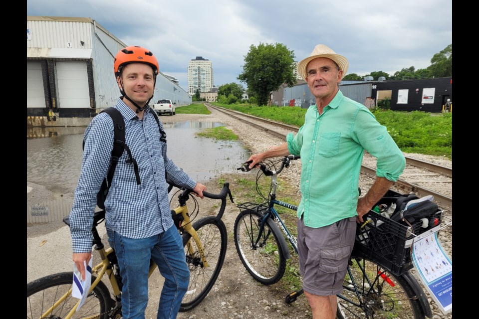 (left to right) Jason Szewc and Mike Darmon from the Guelph Coalition for Active Transportation take a ride along the proposed site of a proposed transportation network extension to the Trans Canada Trail. 