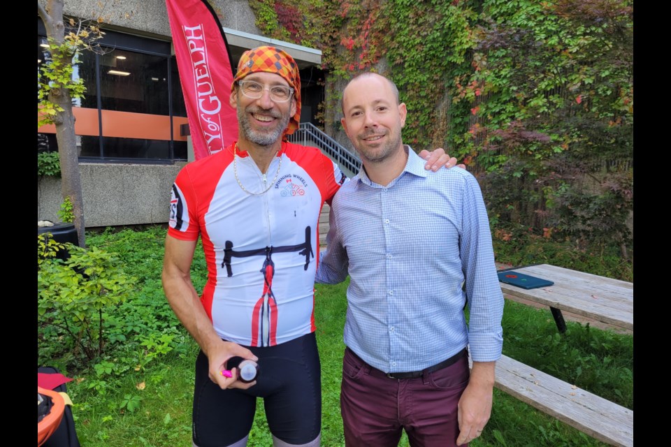 Steve Iseman, from left, from the Spinning Wheels Tour and U of G cardiovascular physiology researcher Philip Millar, from the department of human health and nutritional sciences.