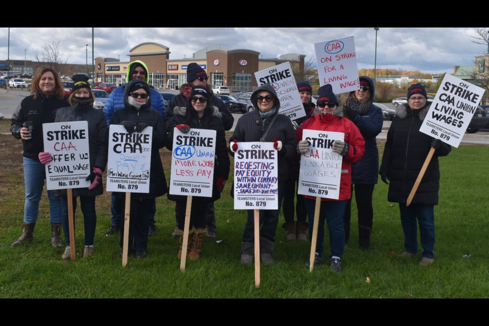 CAA workers on strike outside of Guelph's only CAA store on Tuesday.