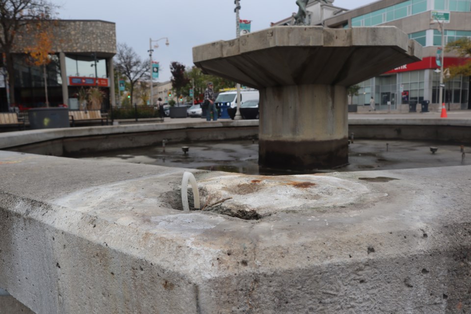 The place where the frog statue used to be at The Family fountain in St. George's Square.