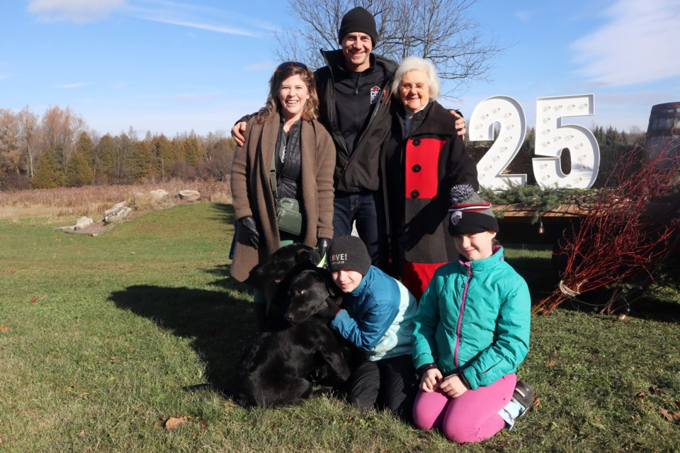 Carly O'Brien, Adrian Trochta, Jerry Trochta, dogs Finnegan and Brix, Anna Trochta, and Vivian Trochta.