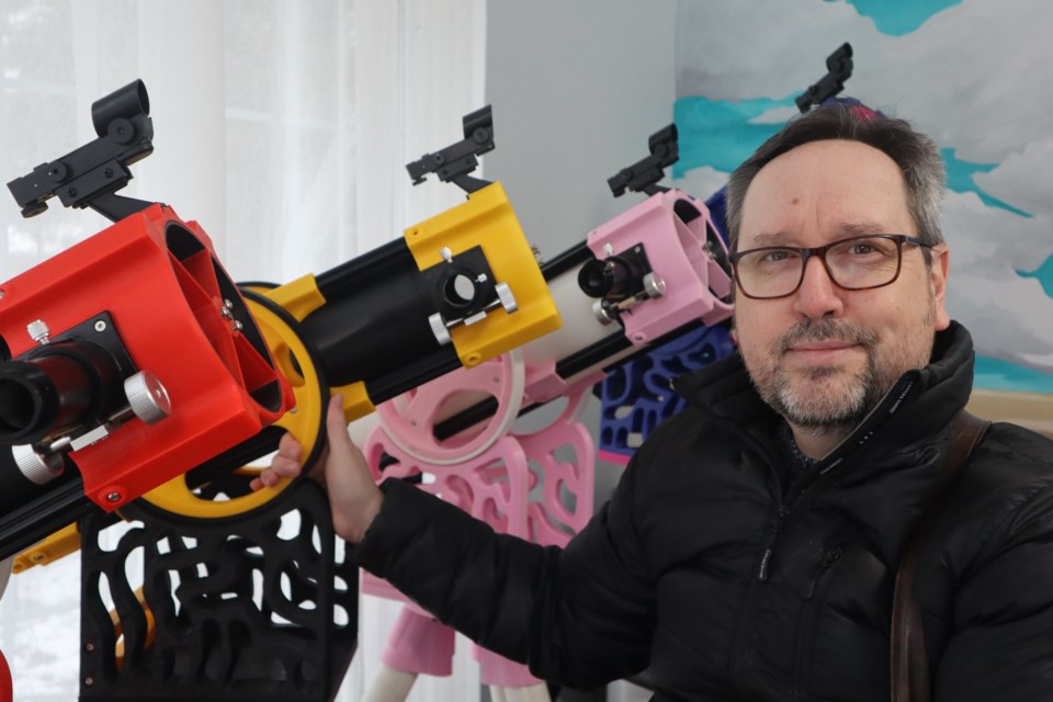 TenTelescopes creator Brian Michel with four of the eight telescopes he and a group of volunteers made. 