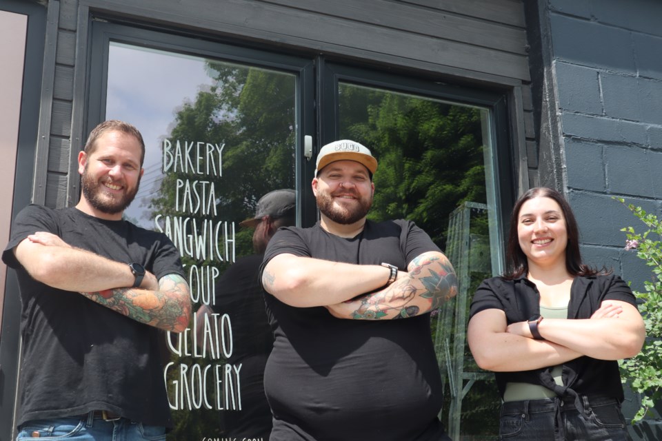 Sugo Mercato chef James Stephenson, owner Alex Tami and pastry chef Laura Tytler outside the market on 60 Ontario St.