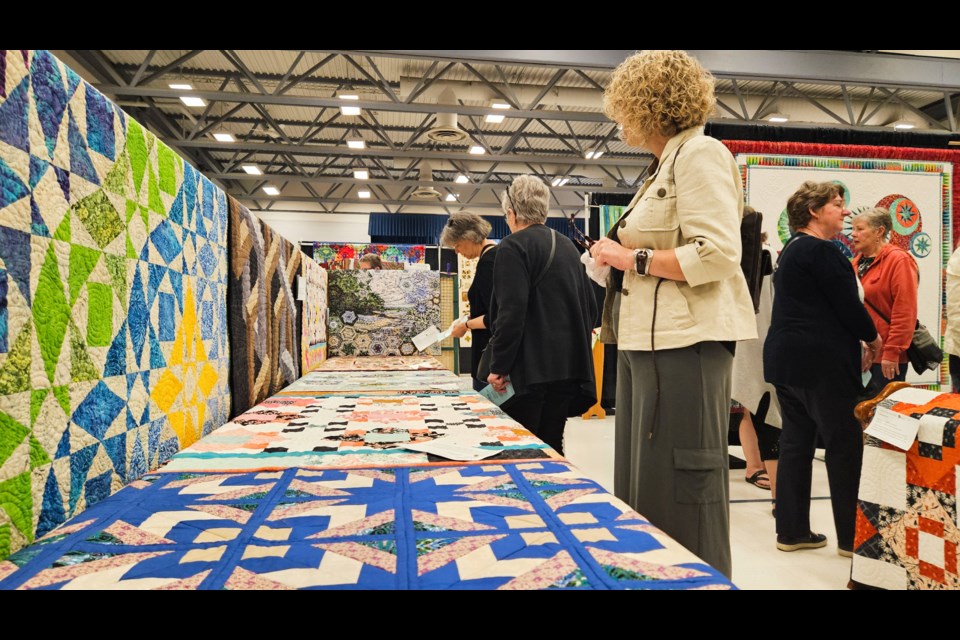 Patrons of the 2024  Quilts On The Grand show at the Centre Wellington Community Sportsplex try to find a match well-known sayings or proverbs with creations from Grand Quilt Guild members. The event ran Friday and Saturday.