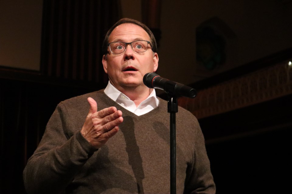 MPP Mike Schreiner answering questions at his town hall at Royal City Mission last week.