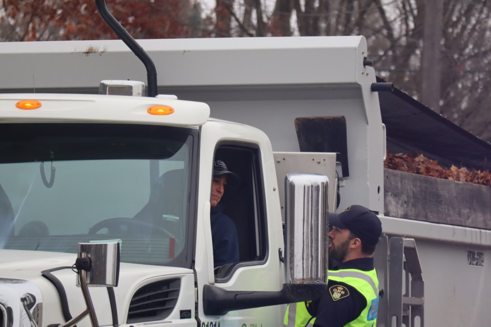 Wellington County OPP talking to a truck driver during the Festive RIDE launch.