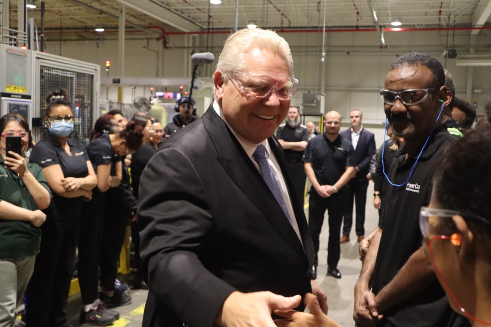 PC party leader Doug Ford shaking hands with Linamar employees.