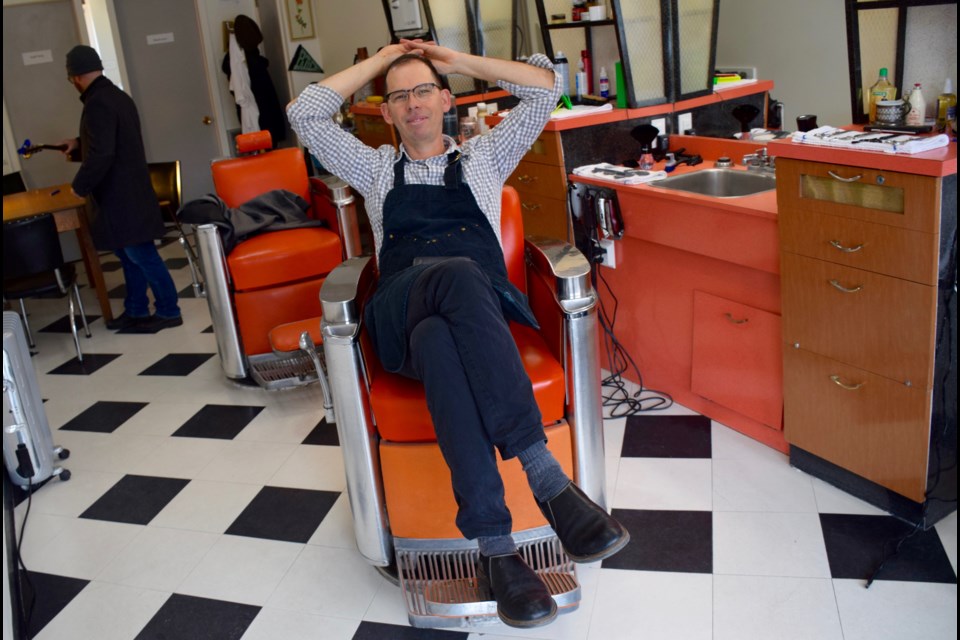 A barber in his chair. Matthew Forbes's shop at 24 Macdonell St. has a 'just drop in' thing going for it. Rob O'Flanagan/GuelphToday