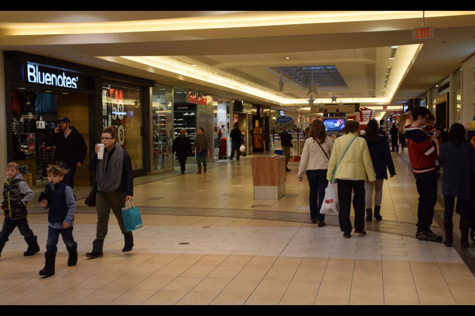 A crowd formed early at the Stone Road Mall on the morning of Boxing Day, despite inclement weather. Rob O'Flanagan/GuelphToday