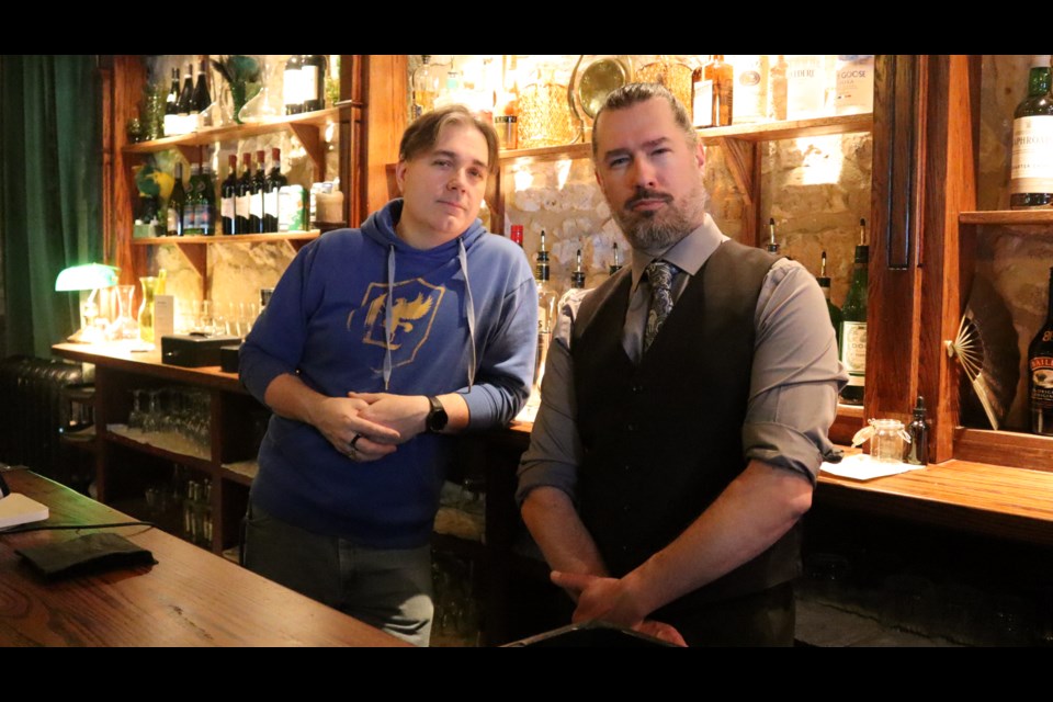 The Albion's owner Thomas Gofton, left, and business manager Aaron Soch stand behind the bar on The Albion's main floor, set to re-open next month.