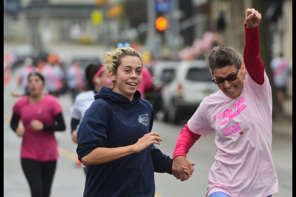 A woman reacts as she crosses the finish line at the Run For The Cure fundraiser for the Canadian Cancer Society Sunday in Downtown Guelph. Roughly 1,000 people took part. Tony Saxon/GuelphToday