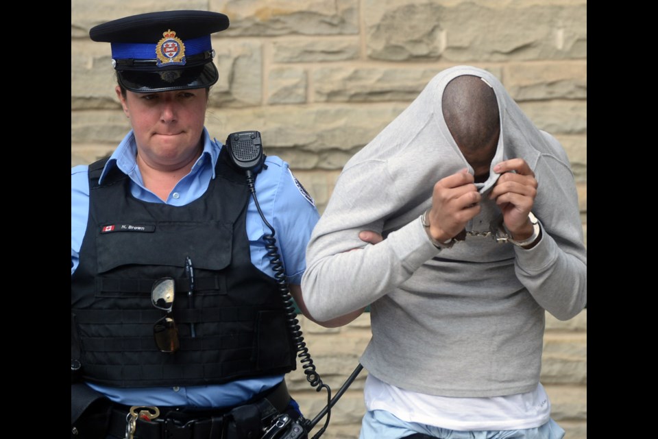 Nakeem Johnson is led out of the Ontario Court of Justice Thursday, Sept. 22, 2016, after being sentenced to 10 years in jail for a string of armed robberies. Tony Saxon/GuelphToay