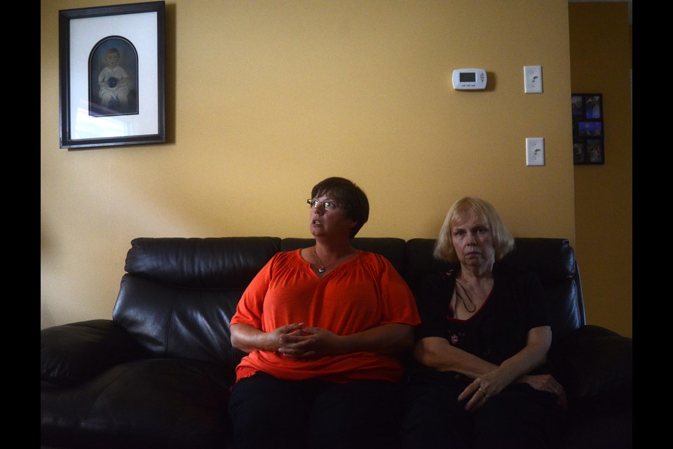 Chris Schweitzer's sister Karen Thompson and his mother Linda sit in Karen's east end home. Tony Saxon/GuelphToday