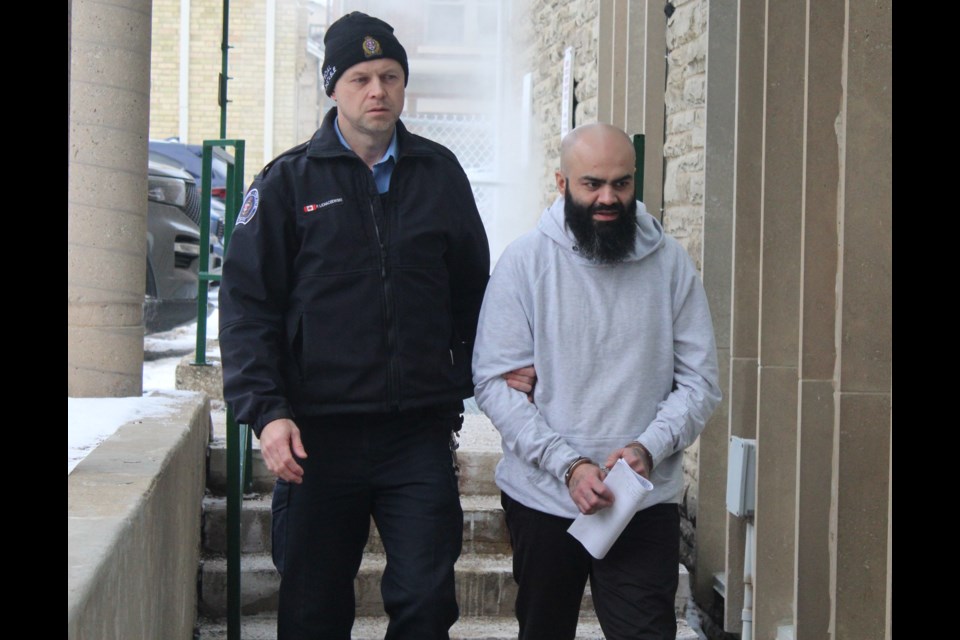 Jaspal Singh Sidhu is led into Guelph's Superior Court of Justice for his second-degree murder trial.