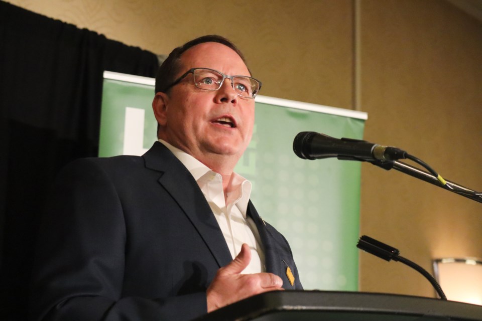 Mike Schreiner addresses a crowd of supporters following his re-election on Thursday evening.