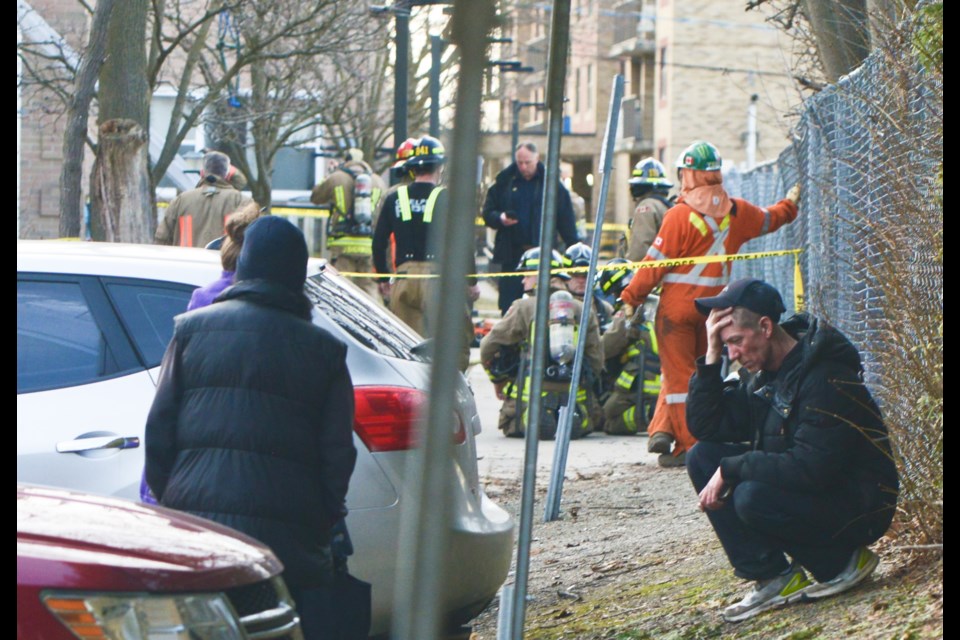 A grief-stricken man gathers himself at the scene of a fatal Guelph fire Wednesday morning on Sunset Road.