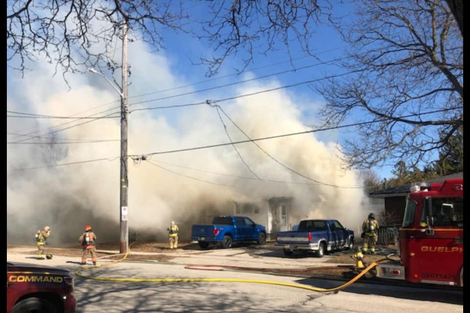 Smoke pours out of 61 Brant Ave. Sunday afternoon.