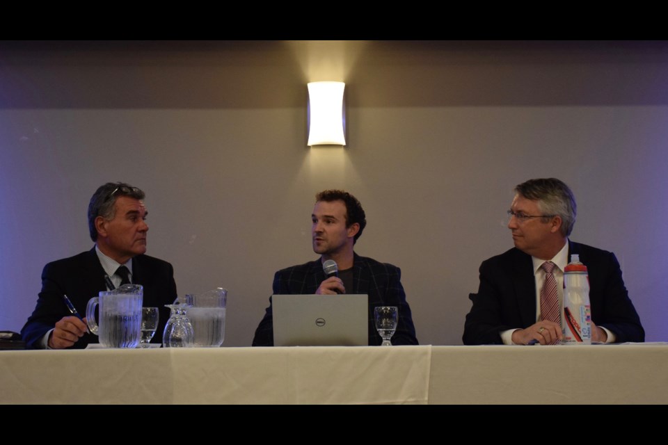 Rob Kerr, left, of the City of Guelph, Kirby Calvert of the University of Guelph, and Guelph MP Lloyd Longfield, lead a town hall on climate change Thursday night. Rob O'Flanagan/GuelphToday