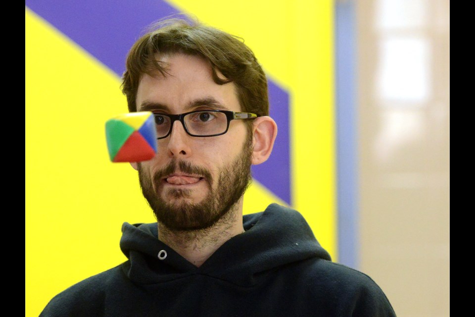 Jay Pereira concentrates while juggling at the Guelph Public Library's How To Festival Saturday, April 2, 2016. Tony Saxon/GuelphToday