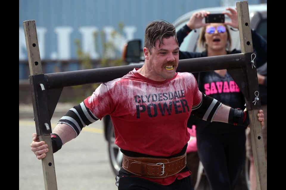 A competitor carries 750 pounds of weights at the Royal Cities Strongest Man and Woman Competition Saturday, April 29, 2017, at the University of Guelph. Tony Saxon/GuelphToday