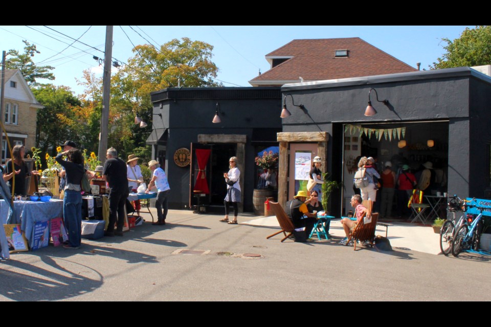 The lot in front of 60 Ontario St. had a steady stream of people throughout the day. Double Rainbow Cafe was named the hub of the first ever Praise The Ward event.