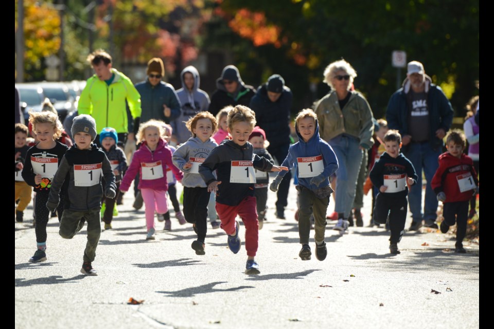 The children's 100m event heads up Exhibition Street at the annual Thanksgiving Day Road Races Monday. It was a solid turnout on a cool but sunny fall morning.