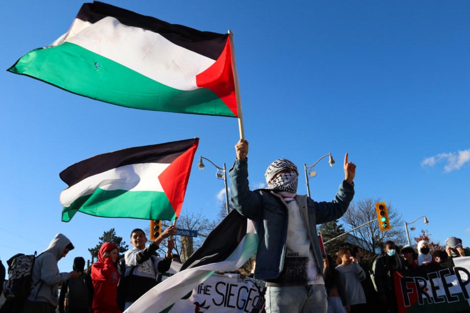 More than 100 students marched downtown Monday afternoon to show solidarity with Palestine. 
