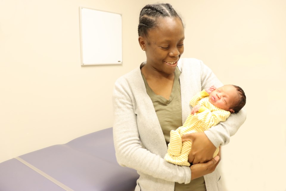 20241007-baby-abriella-asleep-in-the-arms-of-her-mother-marie-while-visiting-the-new-neonatal-and-paediatric-outpatient-clinic-at-guelph-general-hospital