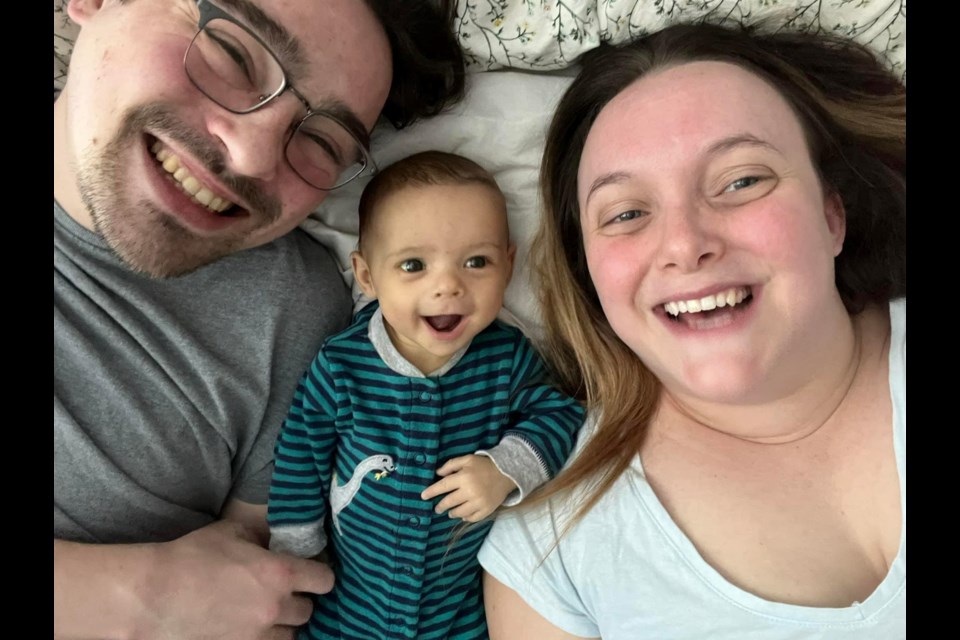 Myles Beaulieu, and his parents Cody Beaulieu and Emily Vokey, are all smiles.