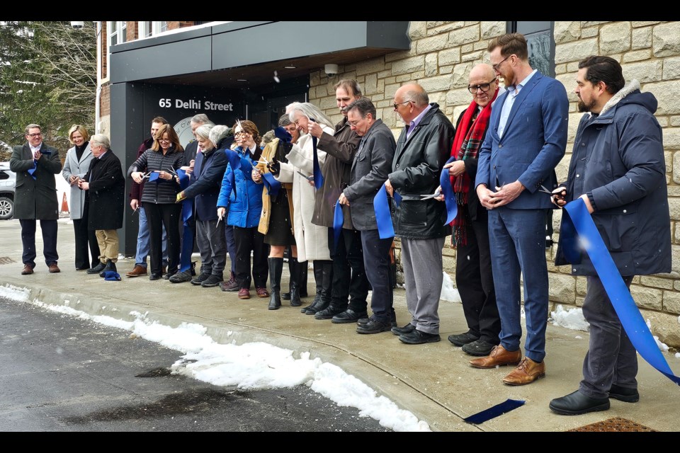 Dignitaries cut the ribbon in front of 65 Delhi Wednesday afternoon.