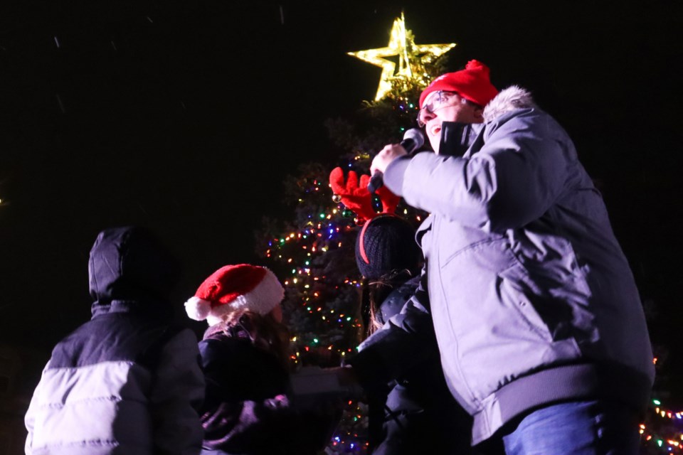 Children from the crowd and Mayor Cam Guthrie pressed a red button to light up the tree at Market Square.