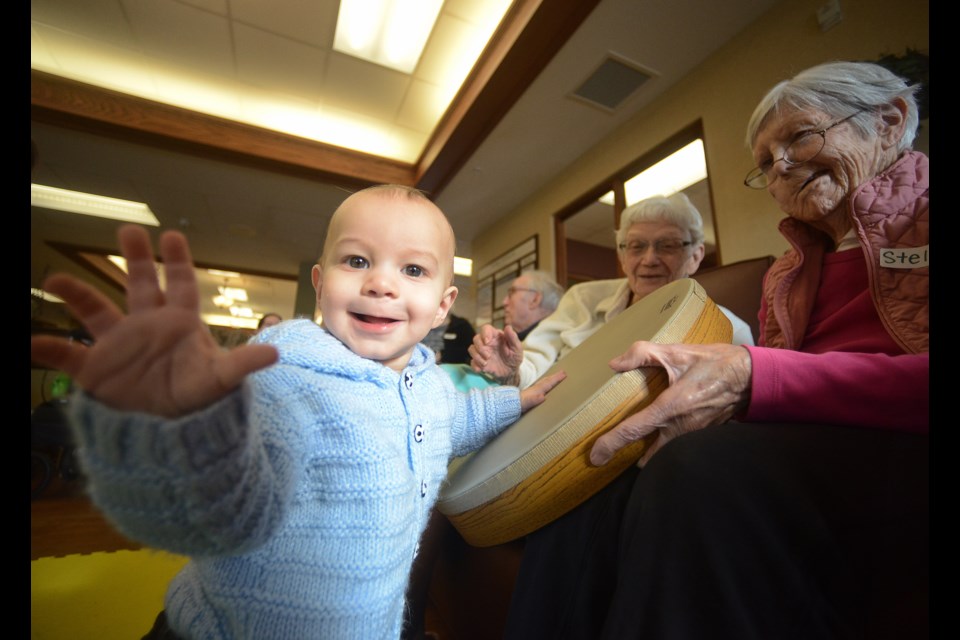 Liam shares a smile while engaging with residents at The Village of Riverside Glen during a music therapy session Thursday, Feb. 1, 2018. Tony Saxon/GuelphToday