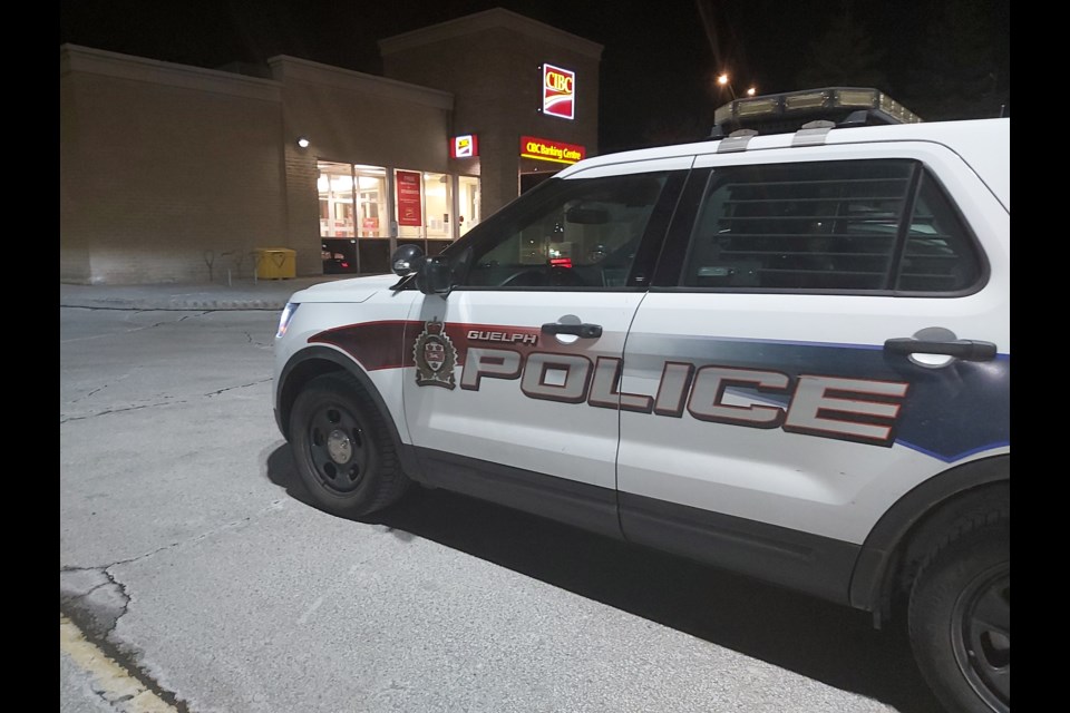 Guelph Police conduct an investigation at the CIBC branch on Stone Road Friday night. Richard Vivian/GuelphToday