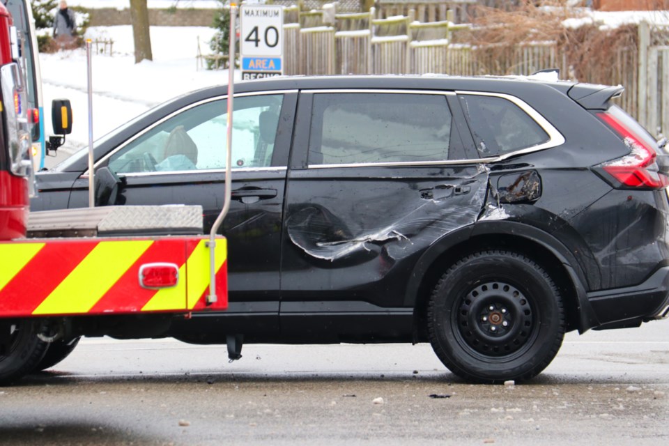 A car appears to have collided with a salt truck