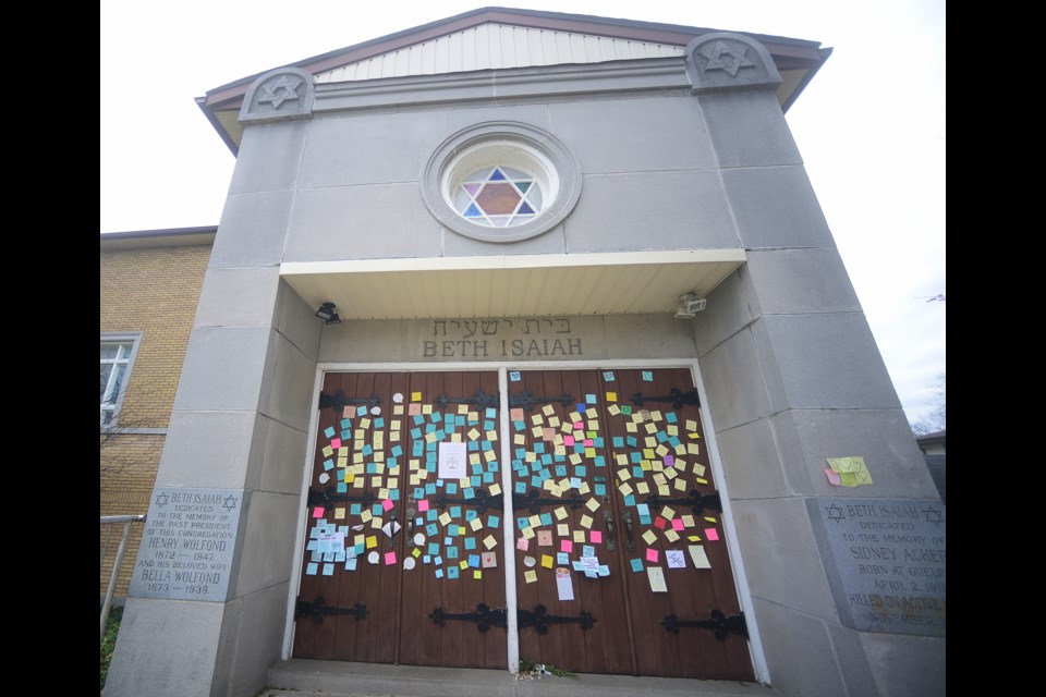 The front doors of Guelph's Beth Isaiah Synagogue on Surrey Street have been covered with notes of support from the community in the wake of the Pittsburgh mass shooting last week. Tony Saxon/GuelphToday