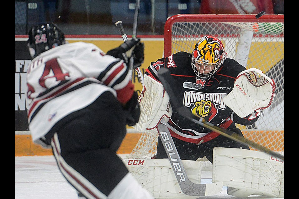 The Guelph Storm's Givani Smith rifles a shot past the head of Owen Sound Attack goaltender Michael McNiven during Guelph's 3-1 win Friday, Oct. 28, 2016, at the Sleeman Centre. Tony Saxon/GuelphToday