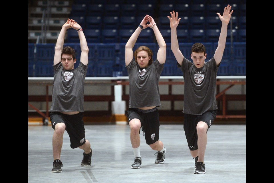 The Guelph Storm's first three picks in the recent OHL draft stretch it out on rookie orientation day at the Sleeman Centre: first rounder Tag Bertuzzi (middle), second rounder Mason Primeau (right), and third rounder Anthony Aguanno. Tony Saxon/GuelphToday