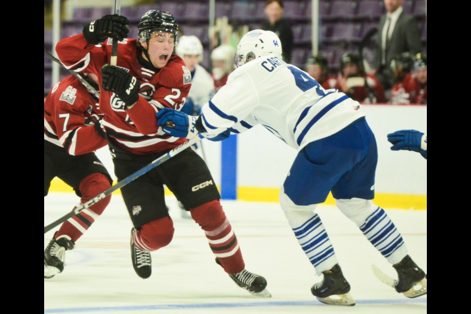 The Guelph Storm's Charlie Paquette is stood up at the Brampton Steelheads blueline in opening pre-season action in Brampton Sunday.