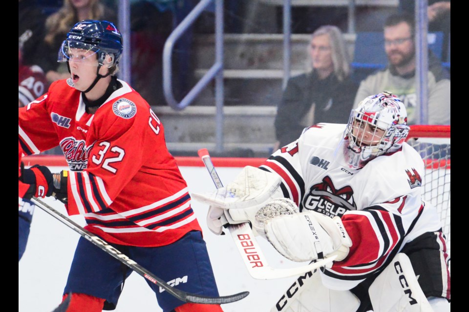 Guelph Storm goaltender Brayden Gillespie shoves an Oshawa Generals player during a power play Saturday night at the Sleeman Centre.