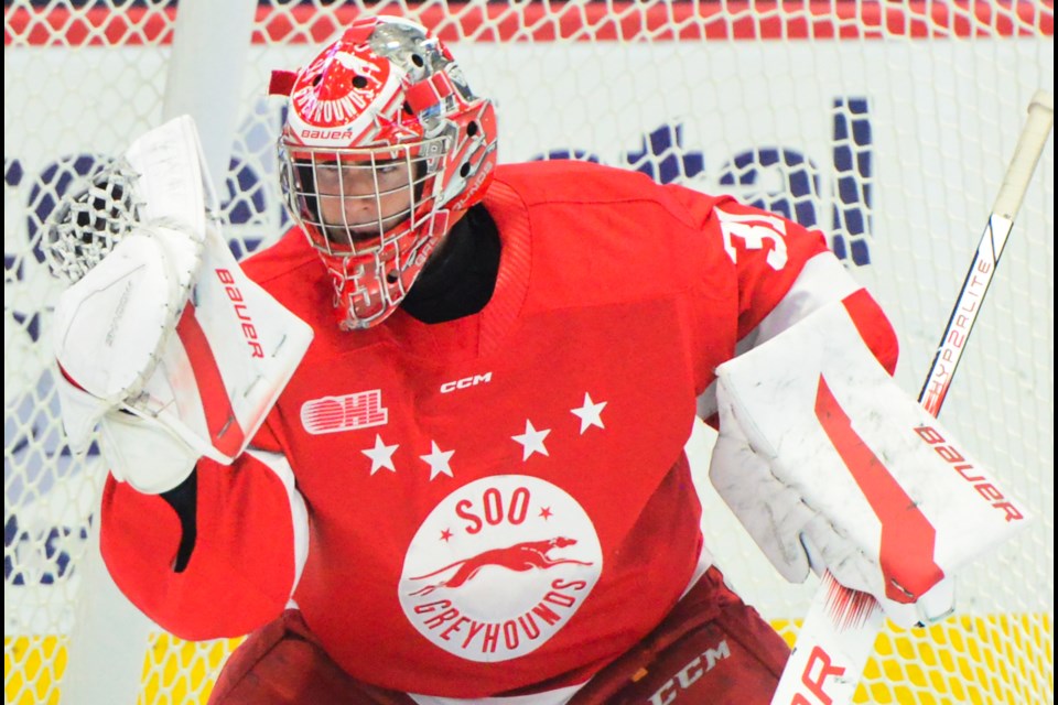 Soo Greyhounds goaltender Charlie Schenkel makes a glove save against the Guelph Storm Friday night.