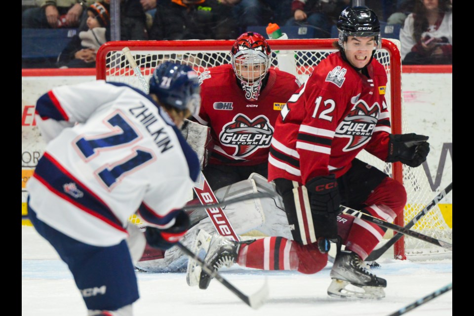 Gueph's Ryan McGuire goes down to block a shot from Saginaw's Damian Zhilkin Saturday night at the Sleeman Centre.