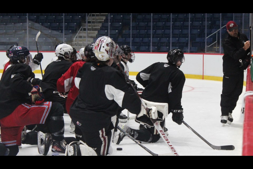 Guelph Storm head coach Cory Stillman draws up a drill for Storm hopefuls Tuesday.