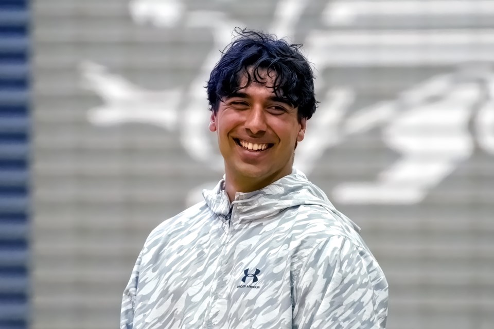 University of Guelph Gryphons quarterback Tristan Aboud smiles at a Toronto Argonauts indoor event with elementary school classes at the Guelph Gryphons Athletics Centre. Aboud was on a quarterbacks internship during the CFL team's training camp in Guelph.