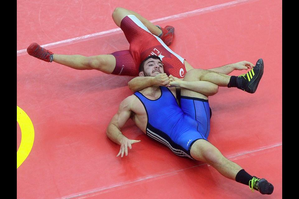 Competitors grapple at the Guelph Open wrestling competition Saturday, Jan. 21, 2017, at the new Mitchell Athletics Centre at the University of Guelph. Tony Saxon/GuelphToday