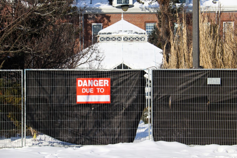 The D.M. Rutherford Family Conservatory is blocked off by fencing as deconstruction begins.