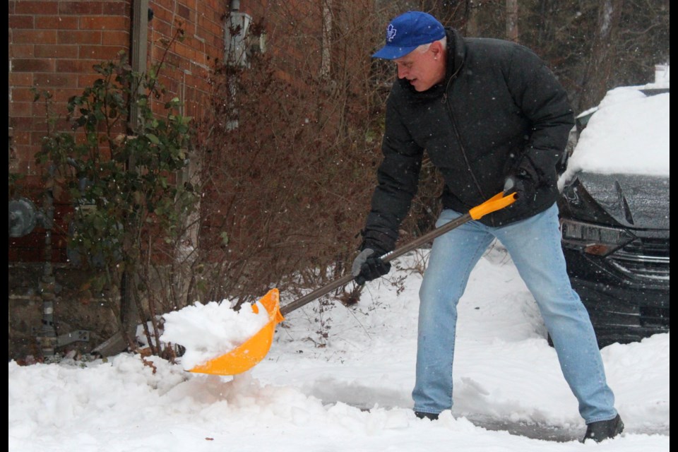 The snow and rain mix made for some heavy snow for residents to shovel Saturday morning.